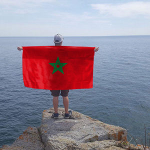 morccan flag for the body in, red flag with green star